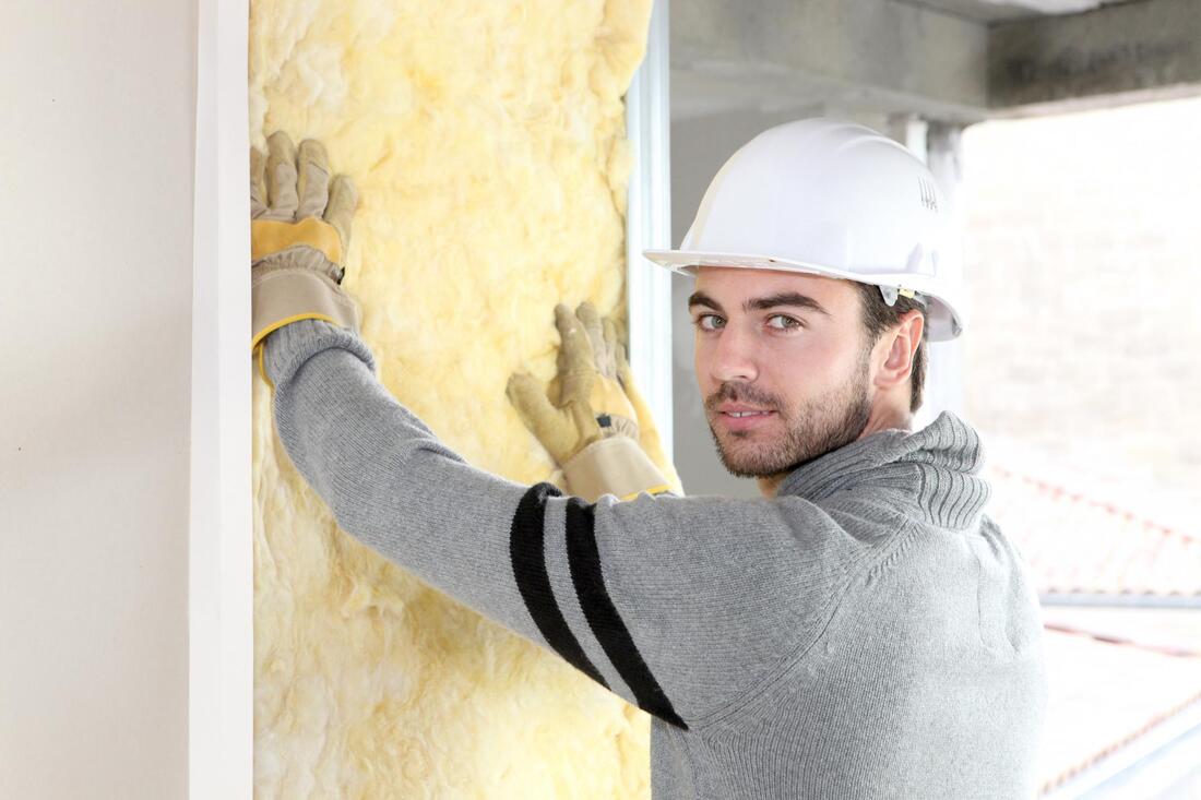 man installing an insulation